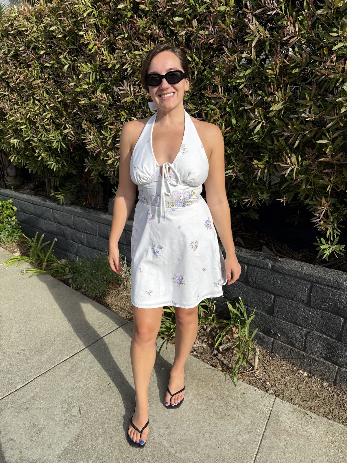 Emily wearing her second Margot dress, sewn from a white vintage flat sheet with little purple flowers